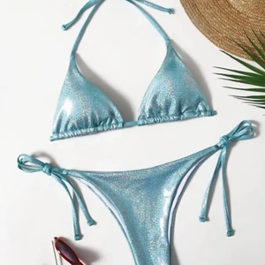 Bikini - En helt ny bikini som inte har används. Säljer pga denna bikini var för liten för mig. Det är en glitter/shimmer blå, super fin och trendig bikini