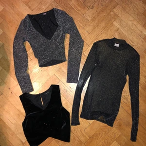 Tre snygga festtoppar - 1. En kort glittrig omlott topp med långa ärmar. 2. En snygg glittrig v-ringad topp i sammet. 3. En genomskinlig glittrig tröja.