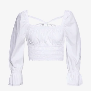 Topp - Söt topp från NA-KD med snörning på ryggen. Använd endast en gång. ordinarie: 429kr