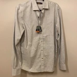 Grå skjorta Morris - Ny grå skjorta från Morris. Stl.L Ordinariepris 699kr, säljer för 500kr pga fel Stl. Mkt bra skick. 