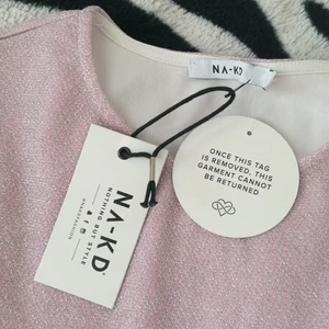 Nakd light pink glittery dress - Fin klänning från nakd, endast testad. Storlek XL, men skulle säga den är mer åt L hållet. Nypris 299:- men säljes för 150:-  