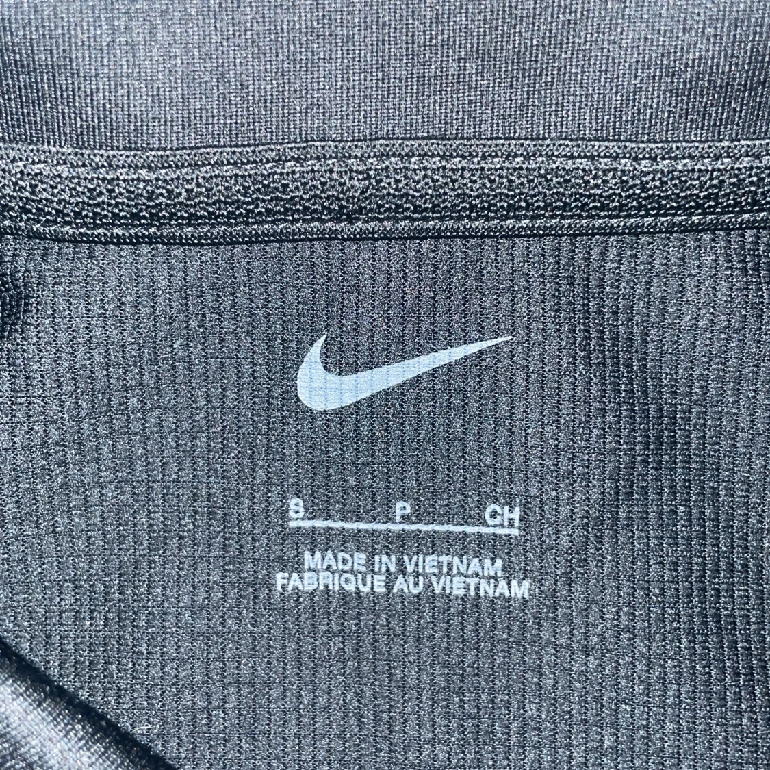 Svart pikétröja från Nike i S - 1