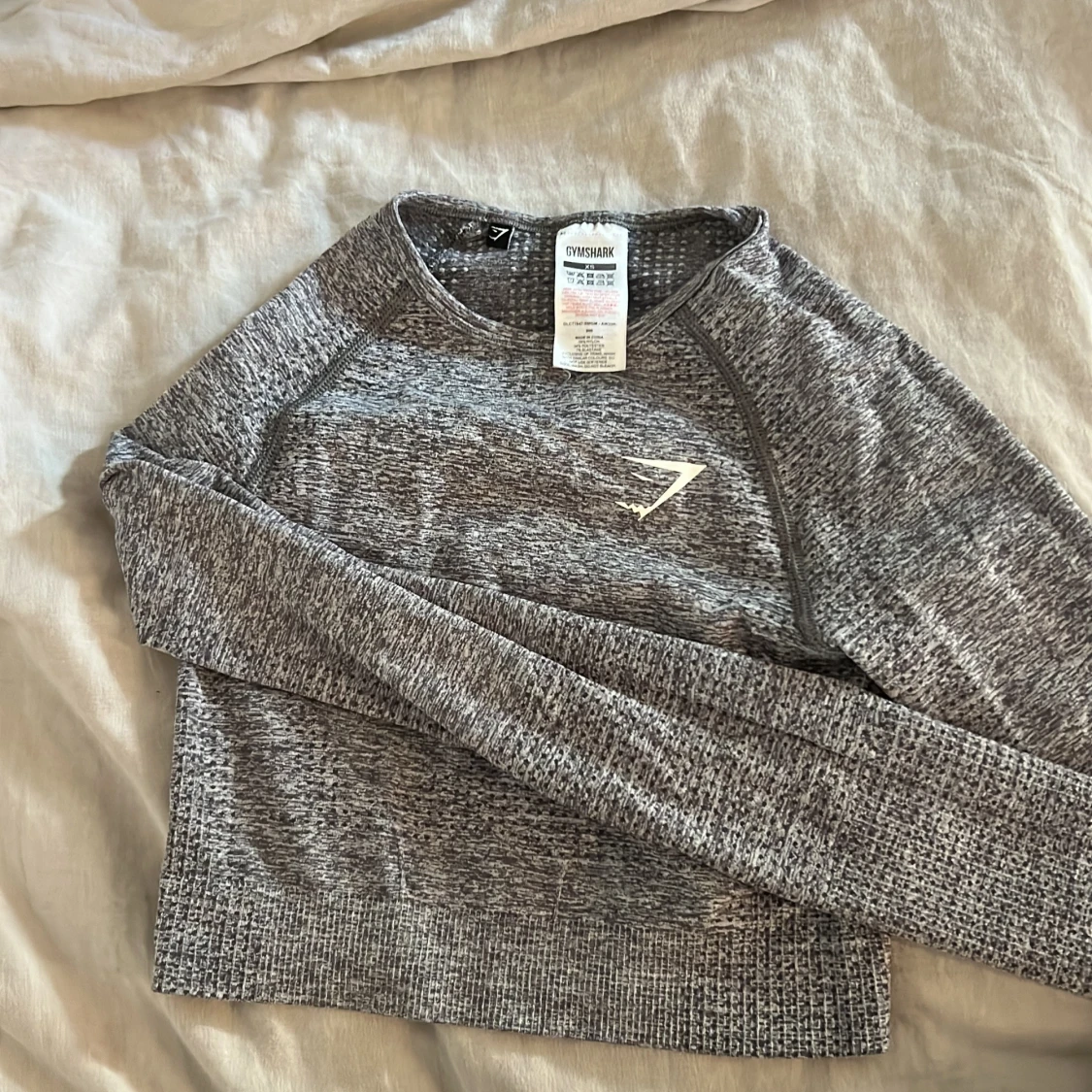 Grå melerad tröja från Gymshark