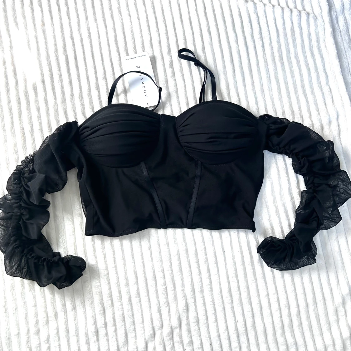 Svart korsettopp med meshärmar Modaline