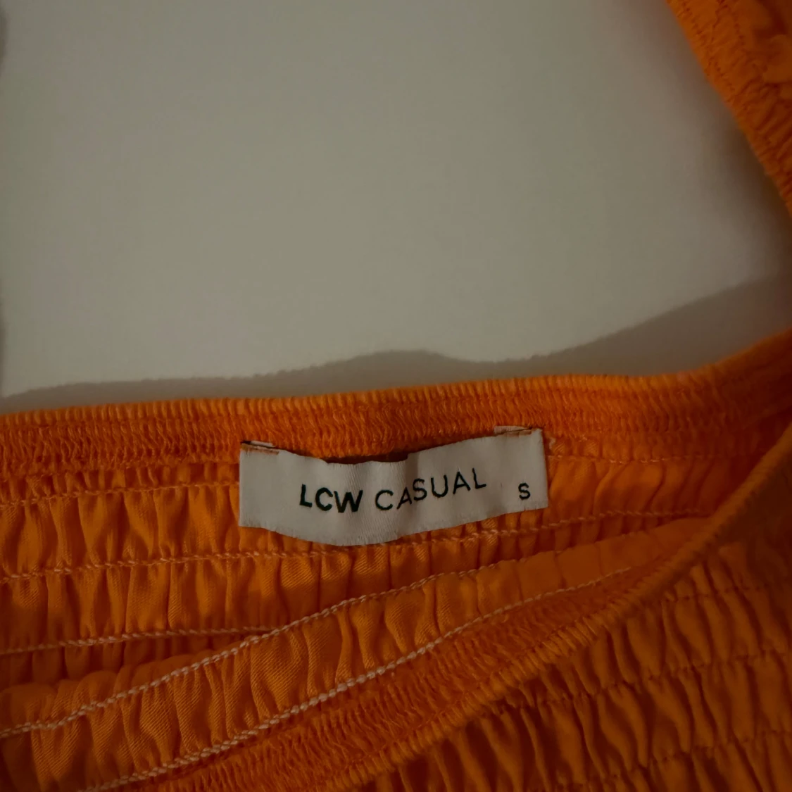 Orange smockad topp - 1