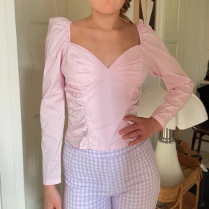 Ljusrosa långärmad korsettopp - Storlek S
