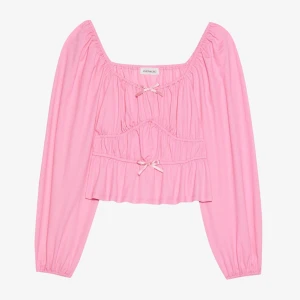 Rosa blus med rosetter - Supersöt topp i nyskick som aldrig kommit till användning i stl S. Köpare står för frakt🩷