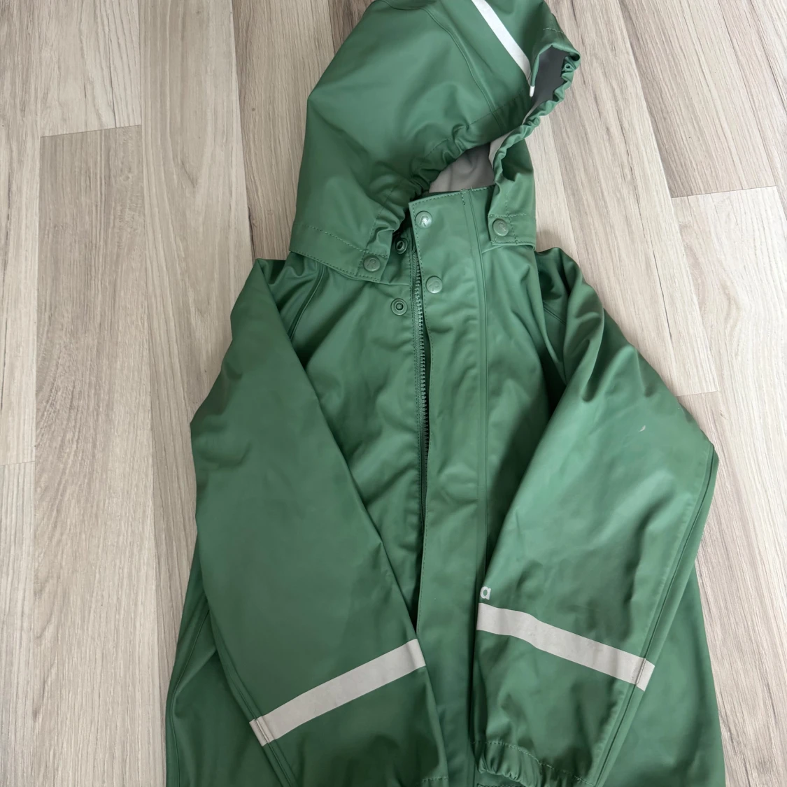 Grön regnjacka från Reima 116 cm