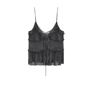 Svart volangtop med snörning/knytning Zara - Säljer en svart topp/blus i storlek S. Knappt använd!