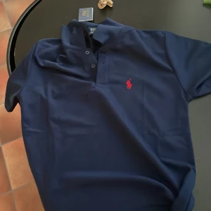 Polo Raplh Lauren T shirt -  Real polo raplh lauren T shirt,Brand new with Tags! Size S and it fits M to! Its 100% Cotton. Its navy blue color