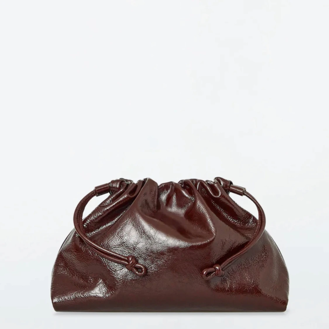 Vinröd skinn axelväska från cos med dragsko