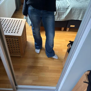 Blå bootcut jeans - Snygga blå bootcut jeans! Från next och uppsydda till mig som är 165 cm. Jättefina bakfickor 