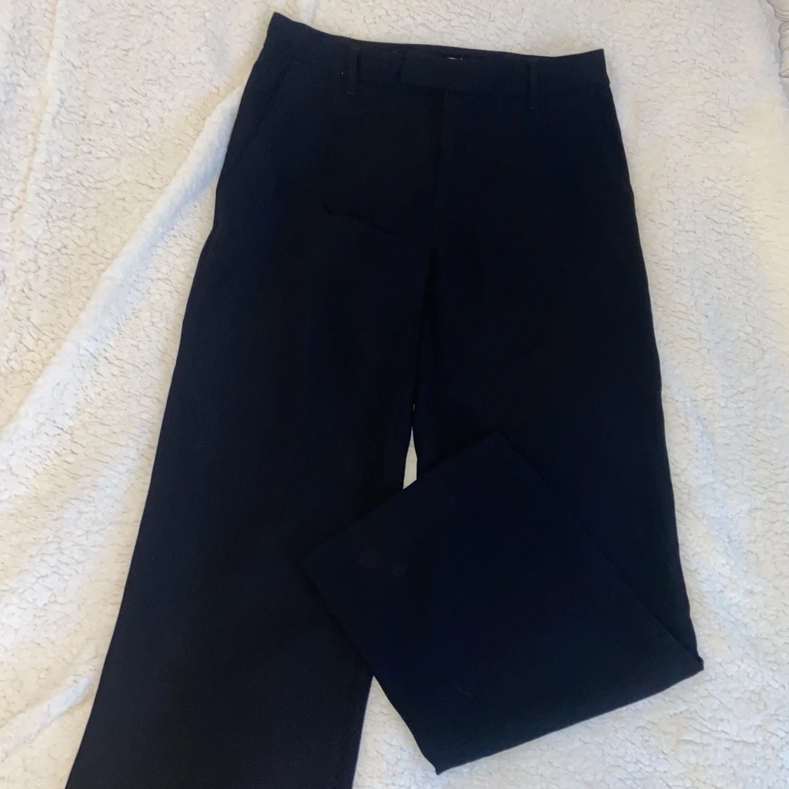 Svarta kostymbyxor
