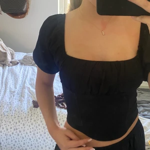 Svart topp - Nyskick