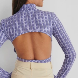 Body med öppen rygg - En body med öppen rygg, perfekt nu till sommaren! 