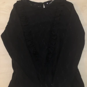 Svart Sommartröja - Sommartröja. Tunnt material där luft kommer in.