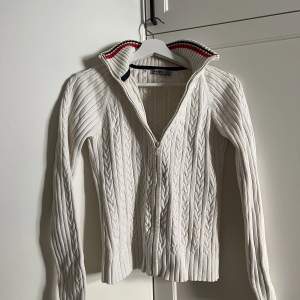 Henri Lloyd zip jumper in white knitted fabric.