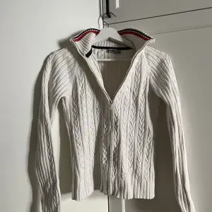 Henri Lloyd zip jumper in white knitted fabric.