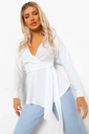 LÅNGÄRMAD OMLOTTBLUS MED KNYTDETALJ I MIDJAN - Jätte fin topp från boohoo som inte sälj längre. Den kommer inte till användning och använd fåtal gånger. För mer frågor och bilder kontaktas mig.