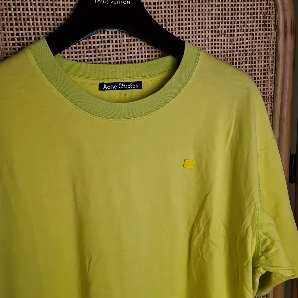 Acne Studios tshirt in yellow with green neck rib and seams, and face patch. From SS21. Bought at sample sale, never worn/washed. New sample condition. Pen mark in label in neck was made before purchase . T-shirts.