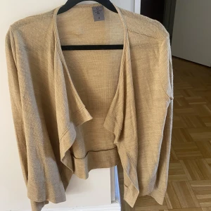 Kofta - Brun kofta, aldrig använd. 