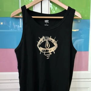 Svart linne  - Svart linne med blekt öga i storlek L