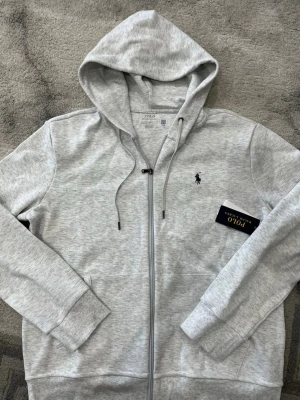 Polo zip - Storlek M, ljusgrå färg 