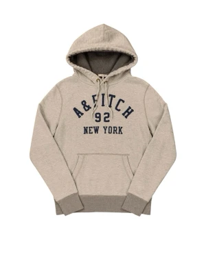 Beige hoodie med tryck från A&Fitch - Snygg beige hoodie från A&Fitch med mörkblå broderad text '92 NEW YORK' på bröstet. Hoodien har huva med dragsko, magficka och ribbade muddar i grått. Perfekt för en avslappnad streetwear-look. Skick 9/10