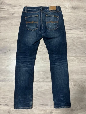 Nudie jeans - Jävligt feta nudie jeans, snygg fade på dem och allt positivt man kan önska sig. Säljer då jeansen var för stora på mig.