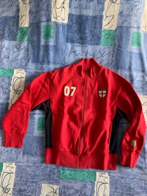 VINTAGE ‘CATSKILL’ TRACK TOP FROM 2002 - EXCLUSIVE ‘CATSKILL’ RANGE.  GOOD CONDITION.  SLIGHTLY FADED DUE TO WASHING.