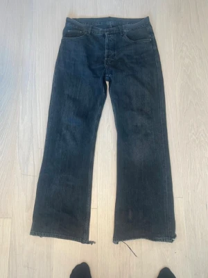 Acne Studios 2021m - Acne studios jeans model 2021m in a washed black colourway. Have worn but condition is still good. One of the best fitting jeans out there. Fits like 31/34  Waist 43cm Length 107cm Leg Opening 27cm Thigh 29cm