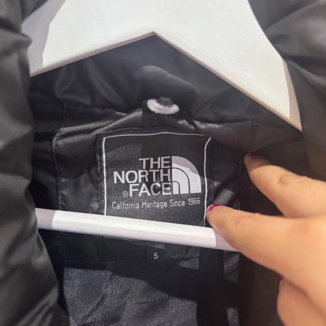 Svart dunväst från The North Face - 2