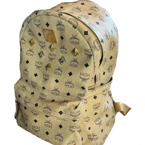 MCM beige backpack - Very good condition, only 2 flaws on the zip but it still works perfectly fine
