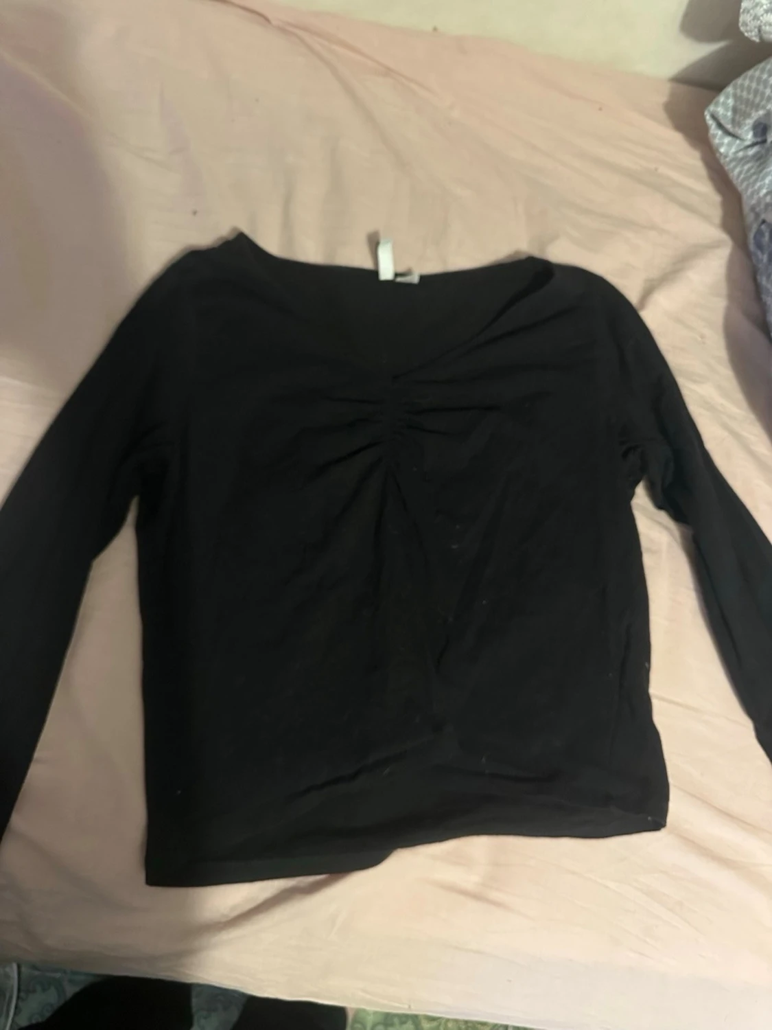 Svart långärmad topp med rynk