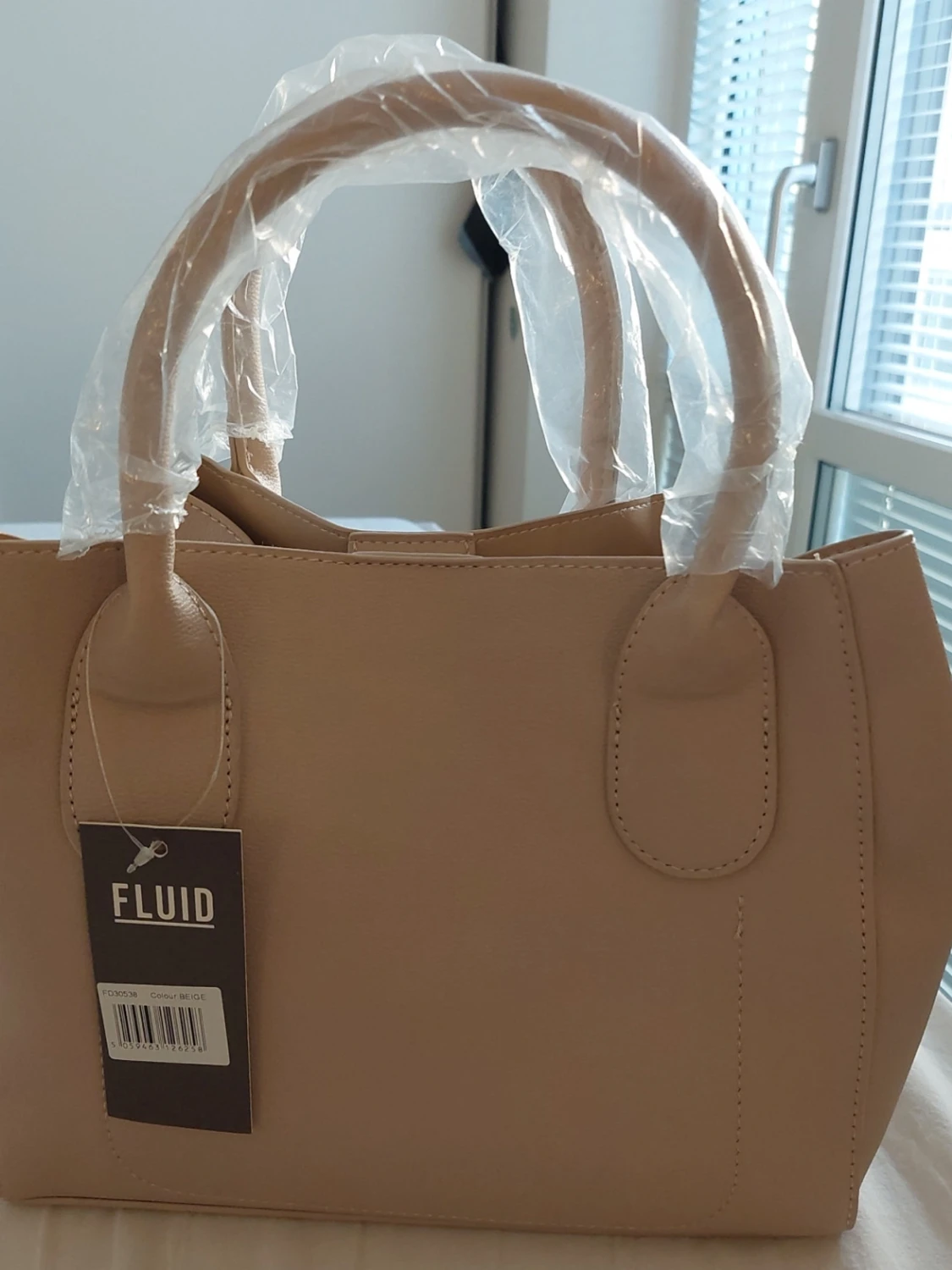 Beige handväska från Fluid