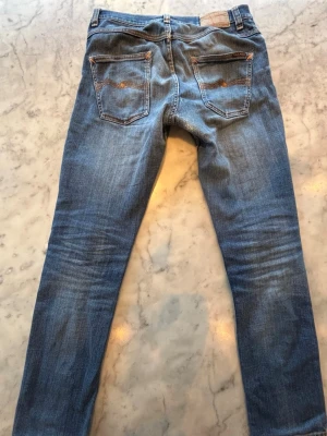 Nudie jeans, Grim Tim, 29/32 - Säljer ett par Grim Tim Indigo Myth, 99% bomull, 1% elastan
