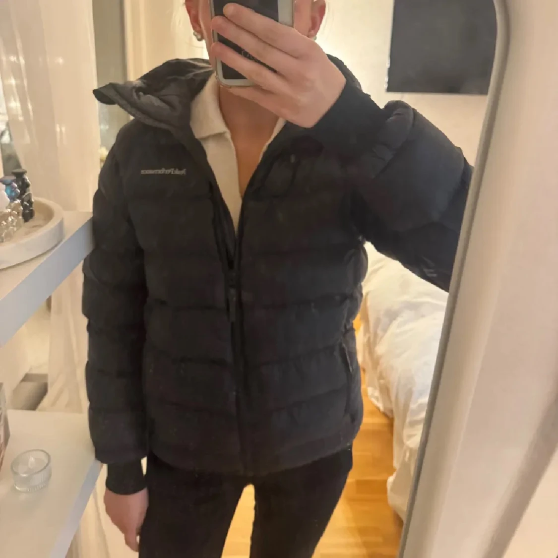 Svart pufferjacka Peak Performance