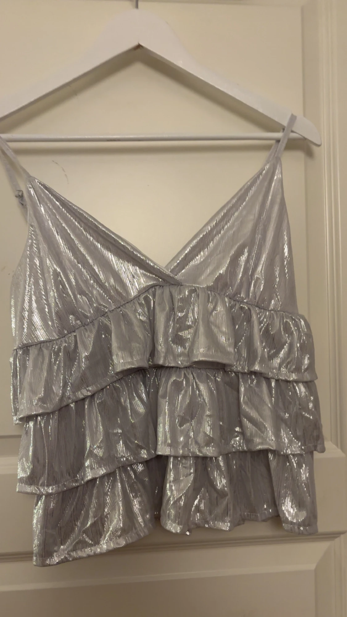 Glittrig silver volang-linnetopp