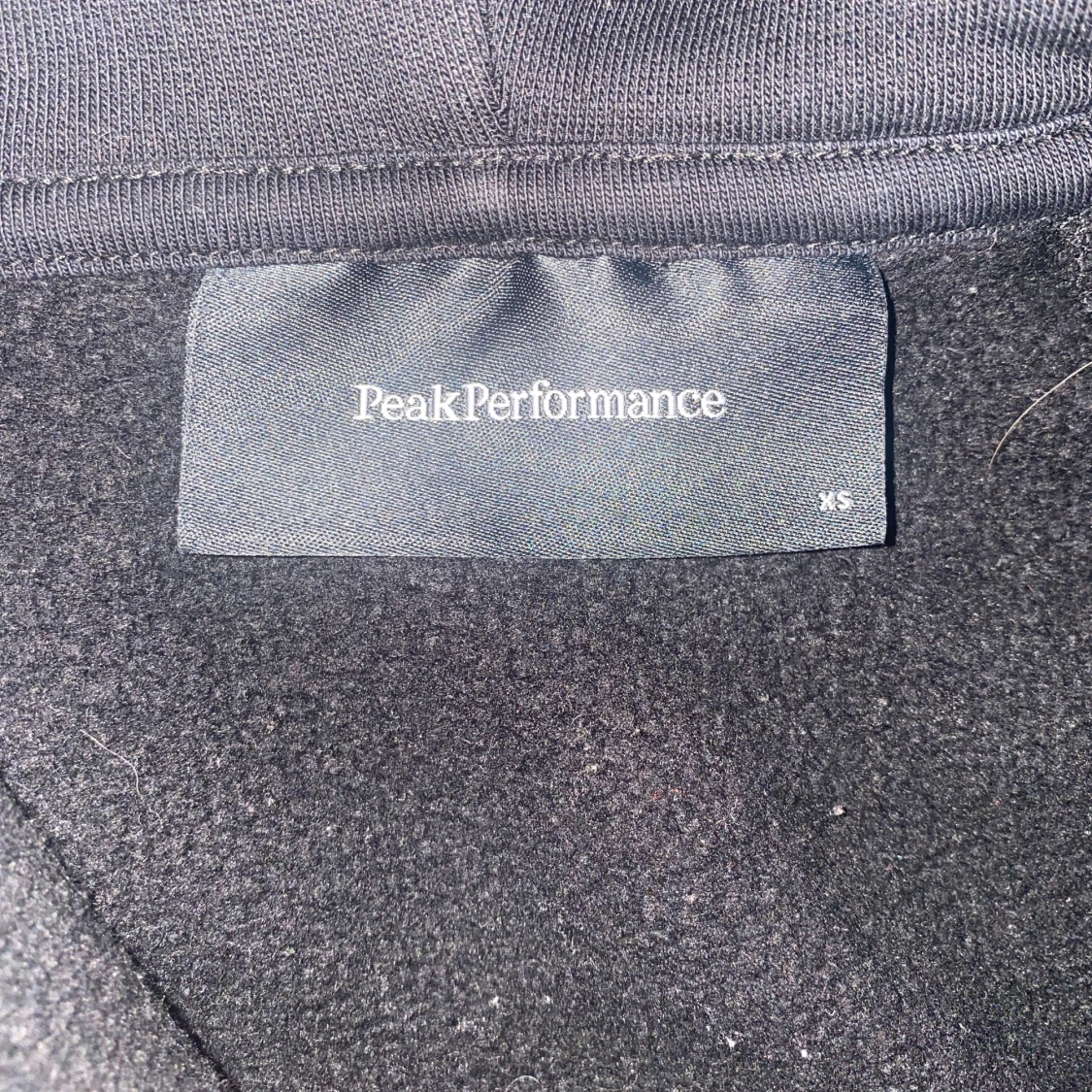 Svart hoodie Peak Performance XS - 1