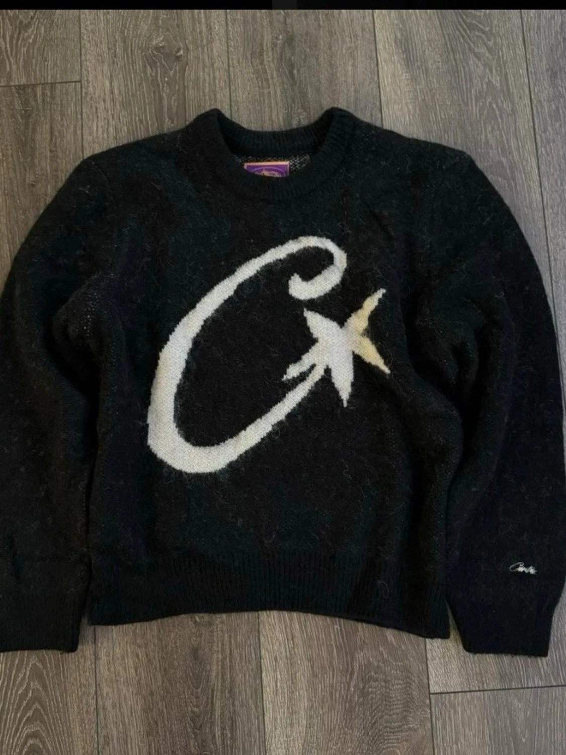 Svart stickad tröja med stjärna från Corteiz