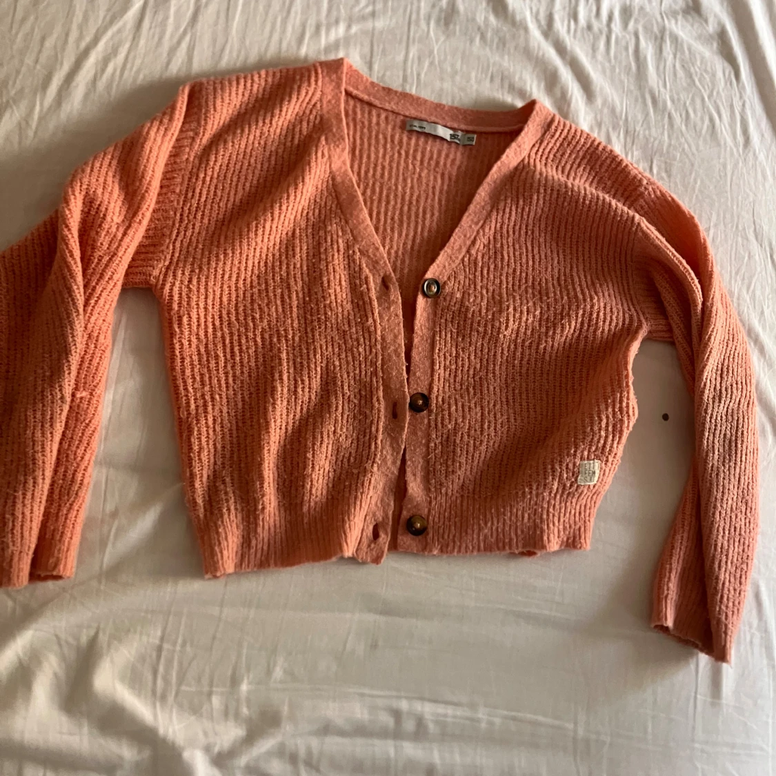 Persikofärgad kofta från 157 - 2