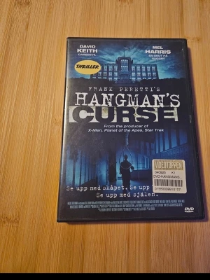 Hangman's Curse  - "familjen Sanders flyttar in i ett hemsökt hus, "The Hell House", som en gång var en skola där en hängd lärare (Mannen) fortfarande sägs hemsöka, och de måste lösa mysteriet med hans förbannelse för att överleva, med fokus på tonåringarna och deras kamp mot övernaturliga krafter och en mörk hemlighet." Från 15år (inspelad 2003)