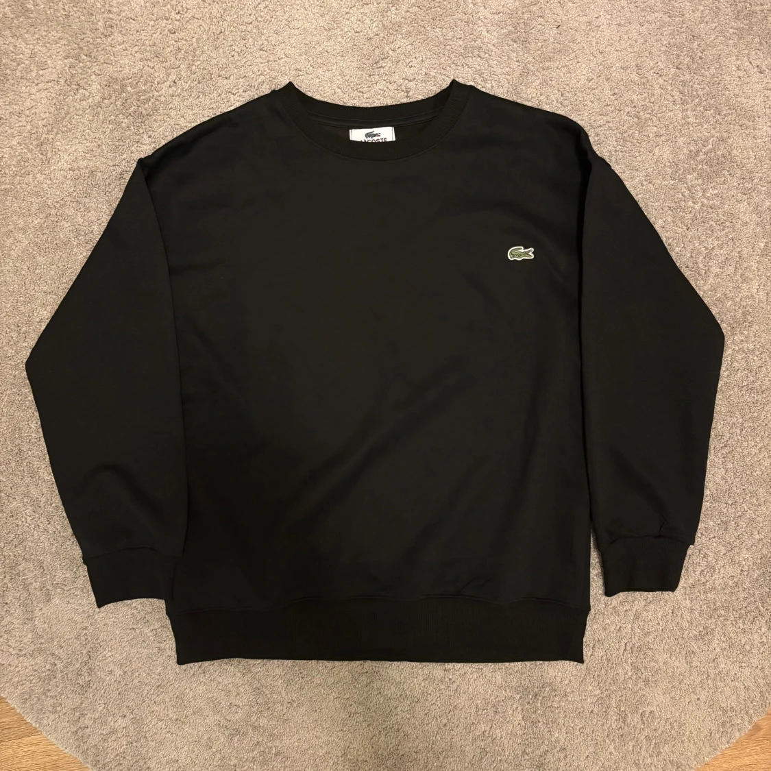 Svart sweatshirt från Lacoste