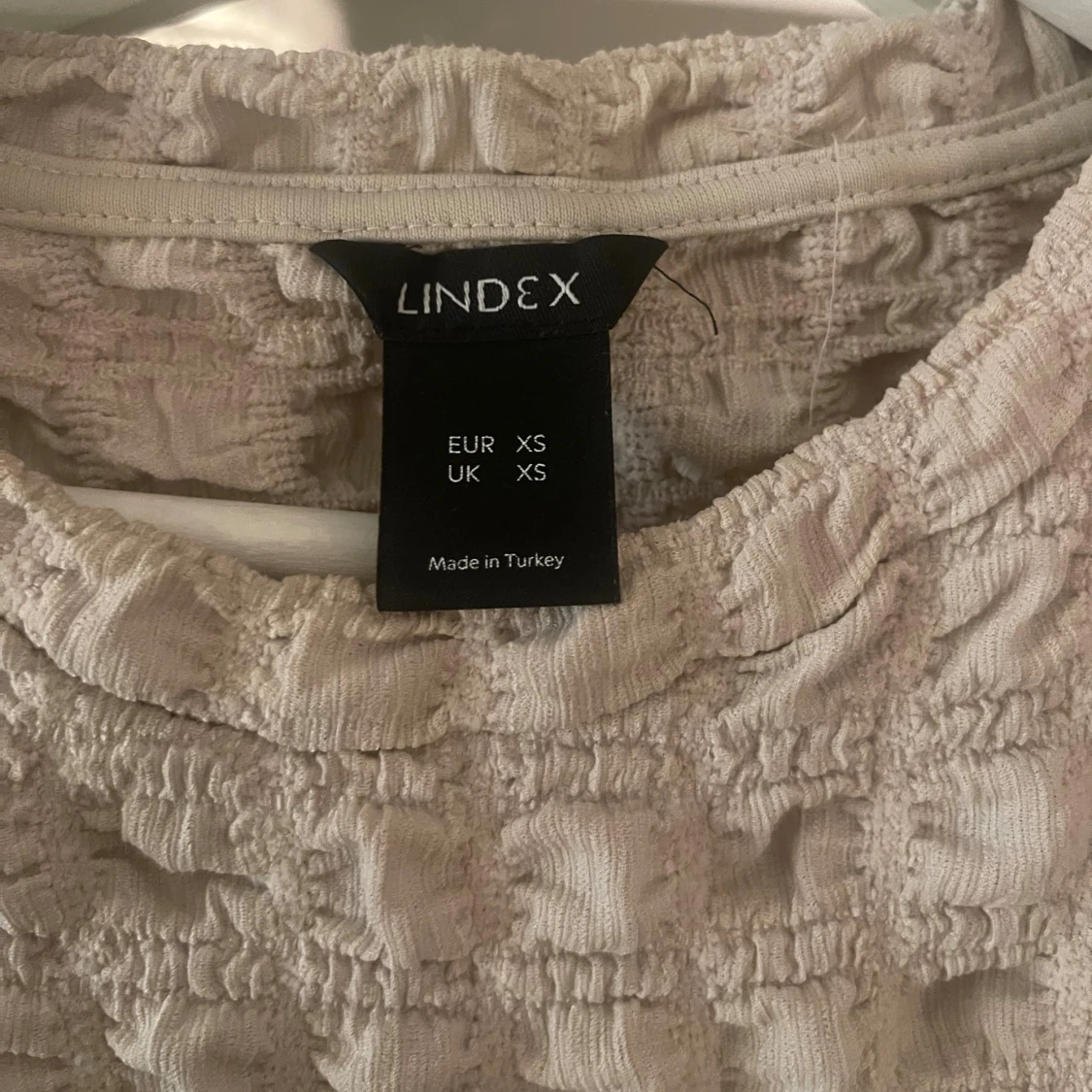 Beige quiltad topp från Lindex XS - 1