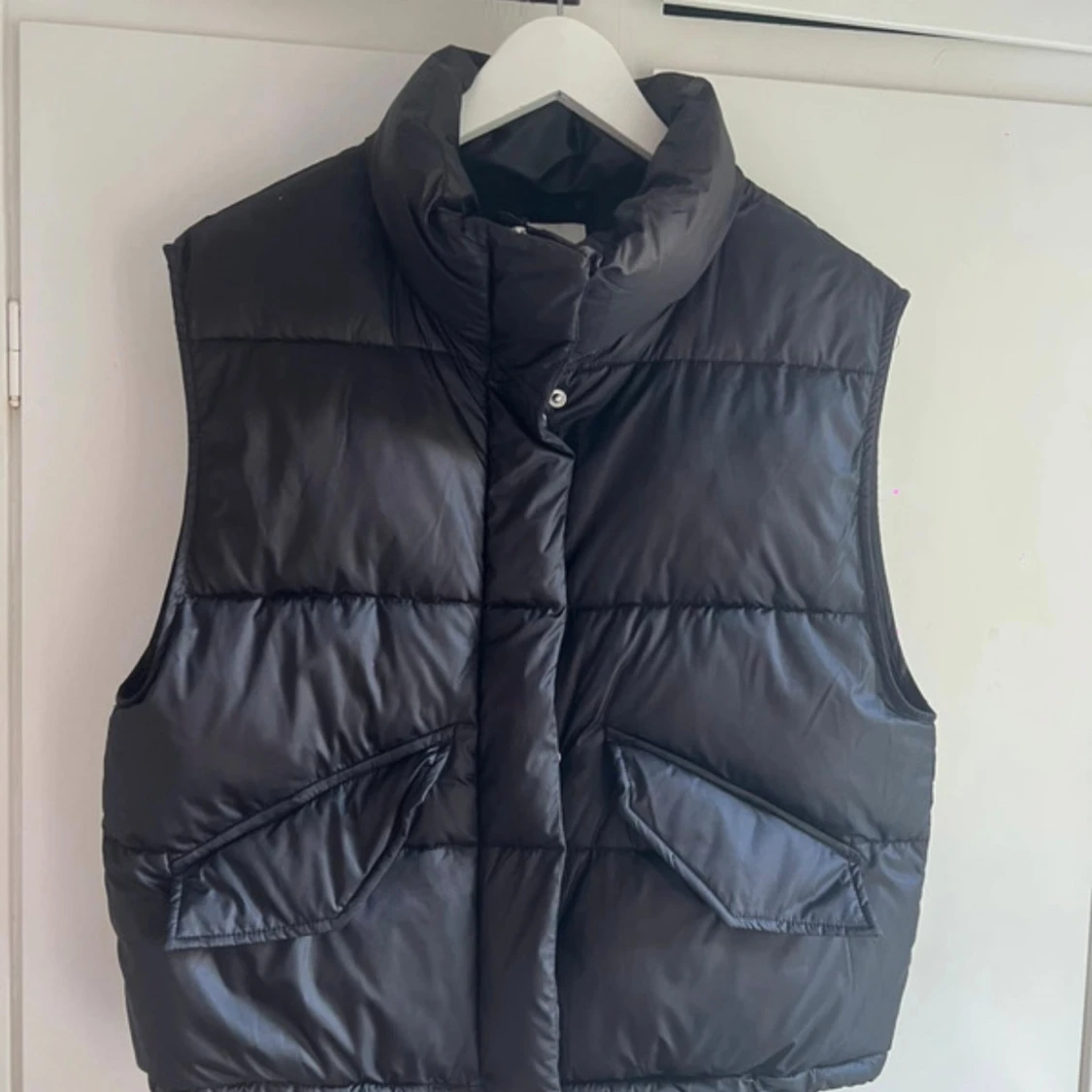 Svart dunväst från H&M XS