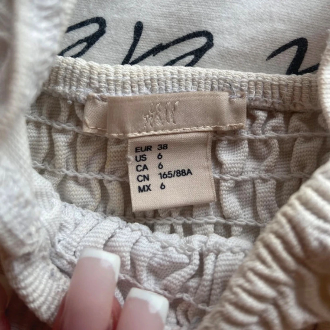 Vit smockad linnetopp från H&M - 2