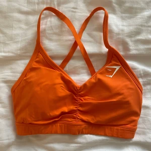 Orange tränings-bh - Orange tränings-bh från Gymshark i strl XS. Använd men i jättefint skick