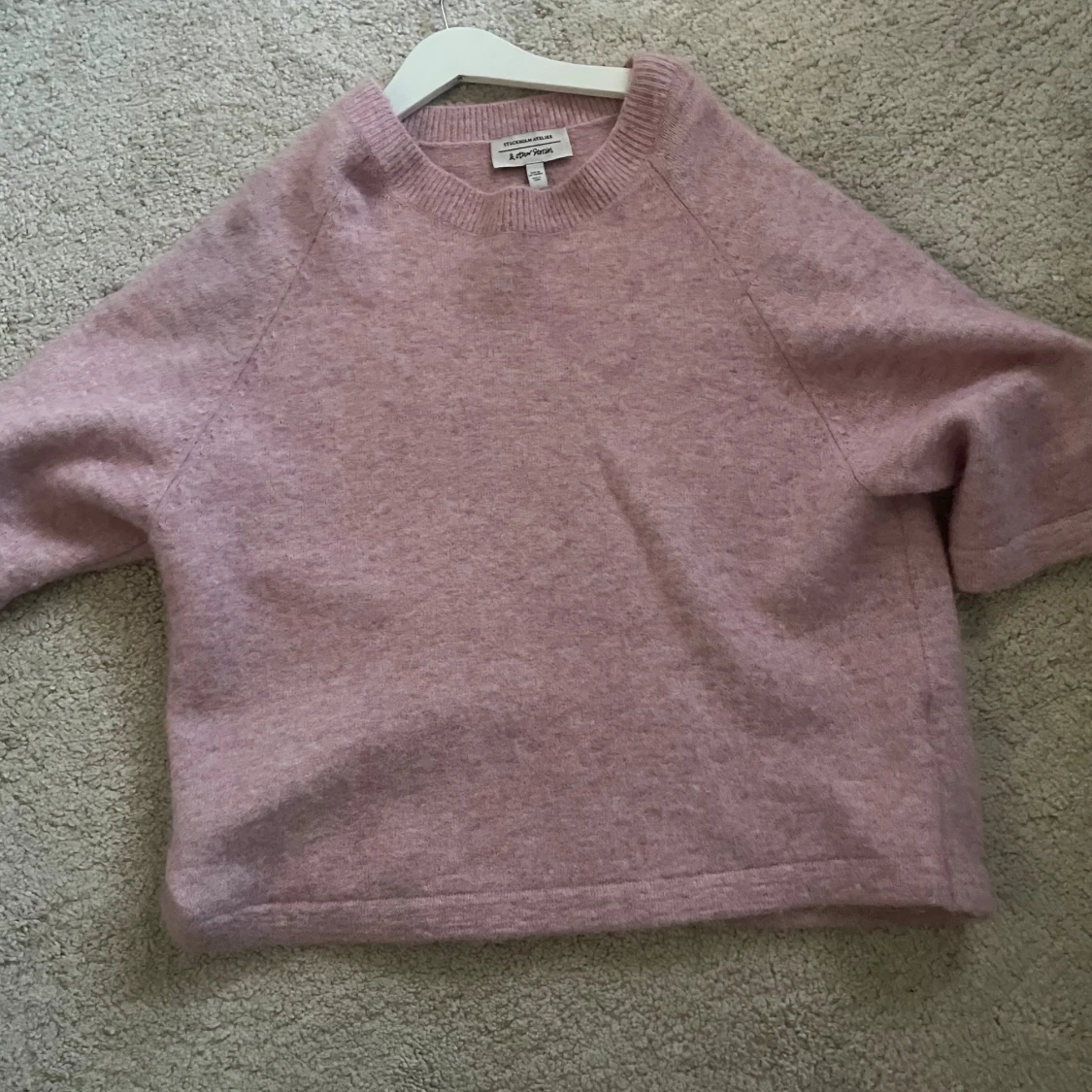 Ljusrosa stickad tröja från American Vintage