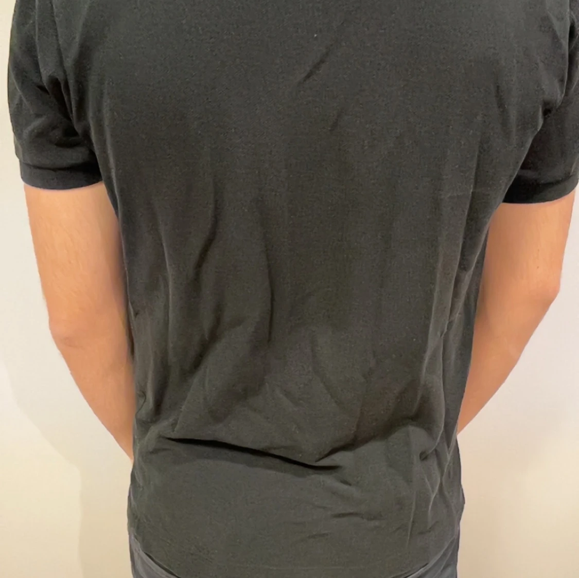 Svart pikétröja från Lacoste - 1