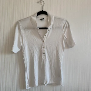 Piké  - Piké från Gina med brunvita knappat